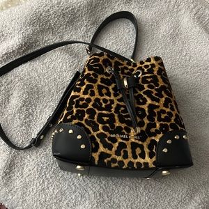 Michael Kors cheetah print bucket bag.